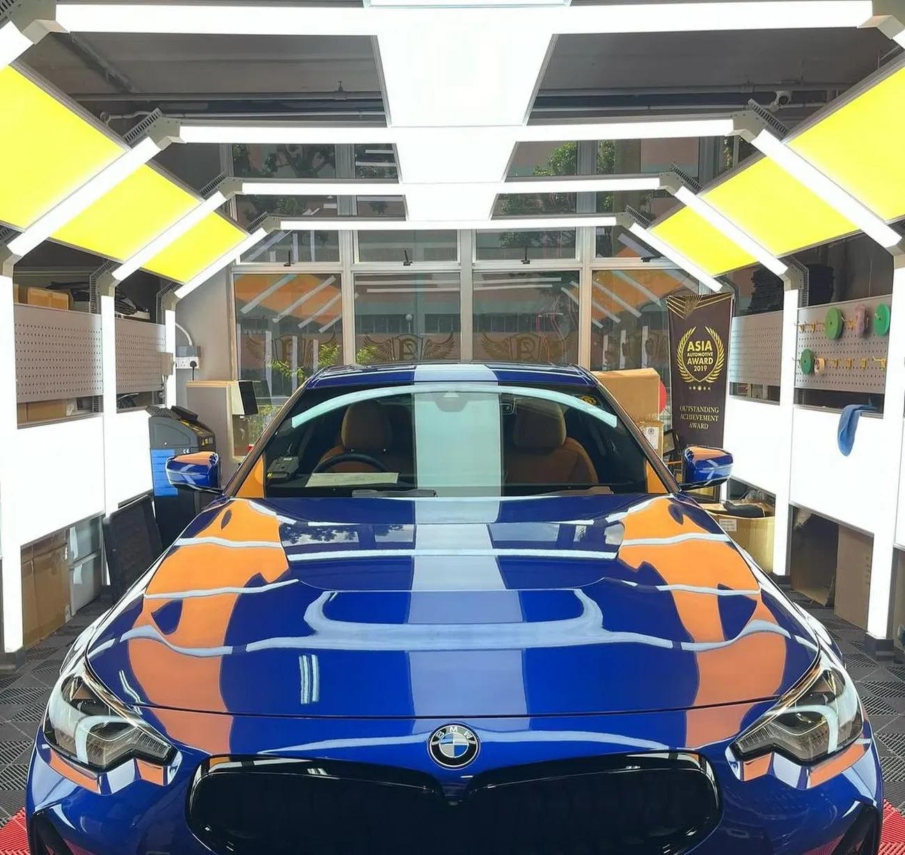BMW with a machine-polished, mirror-finish bonnet at the detailing studio