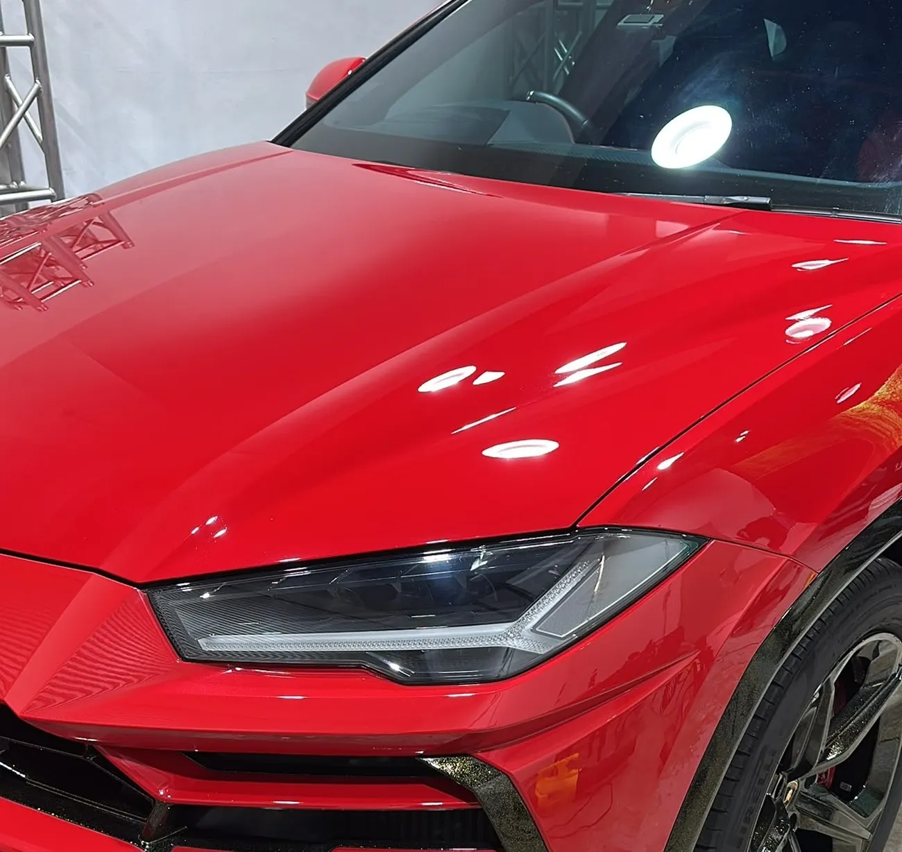 Lamborghini Urus with a machine-polished, mirror-finish bonnet at the detailing studio