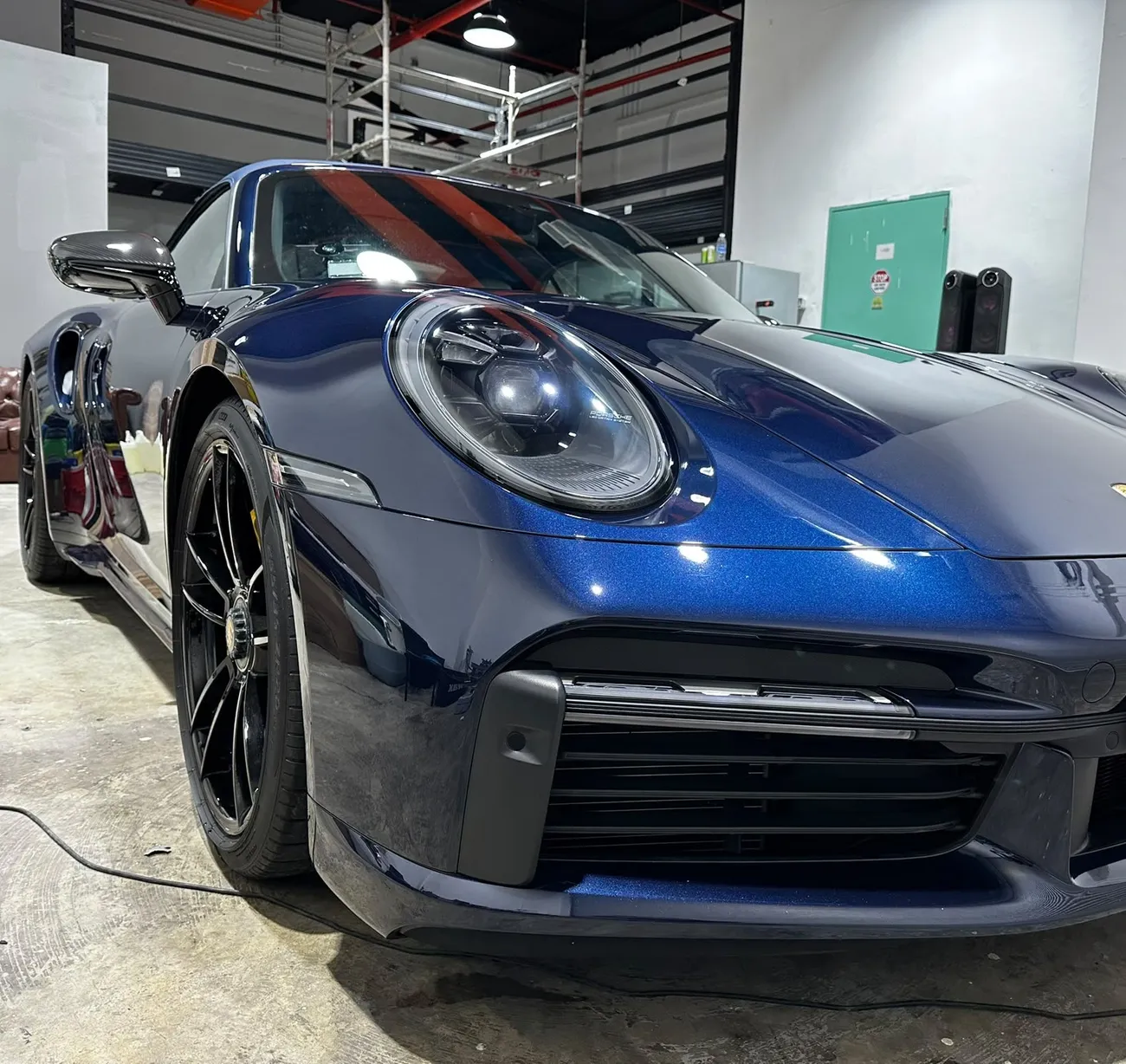 Porsche 911 with a machine-polished, mirror-finish bonnet at the detailing studio