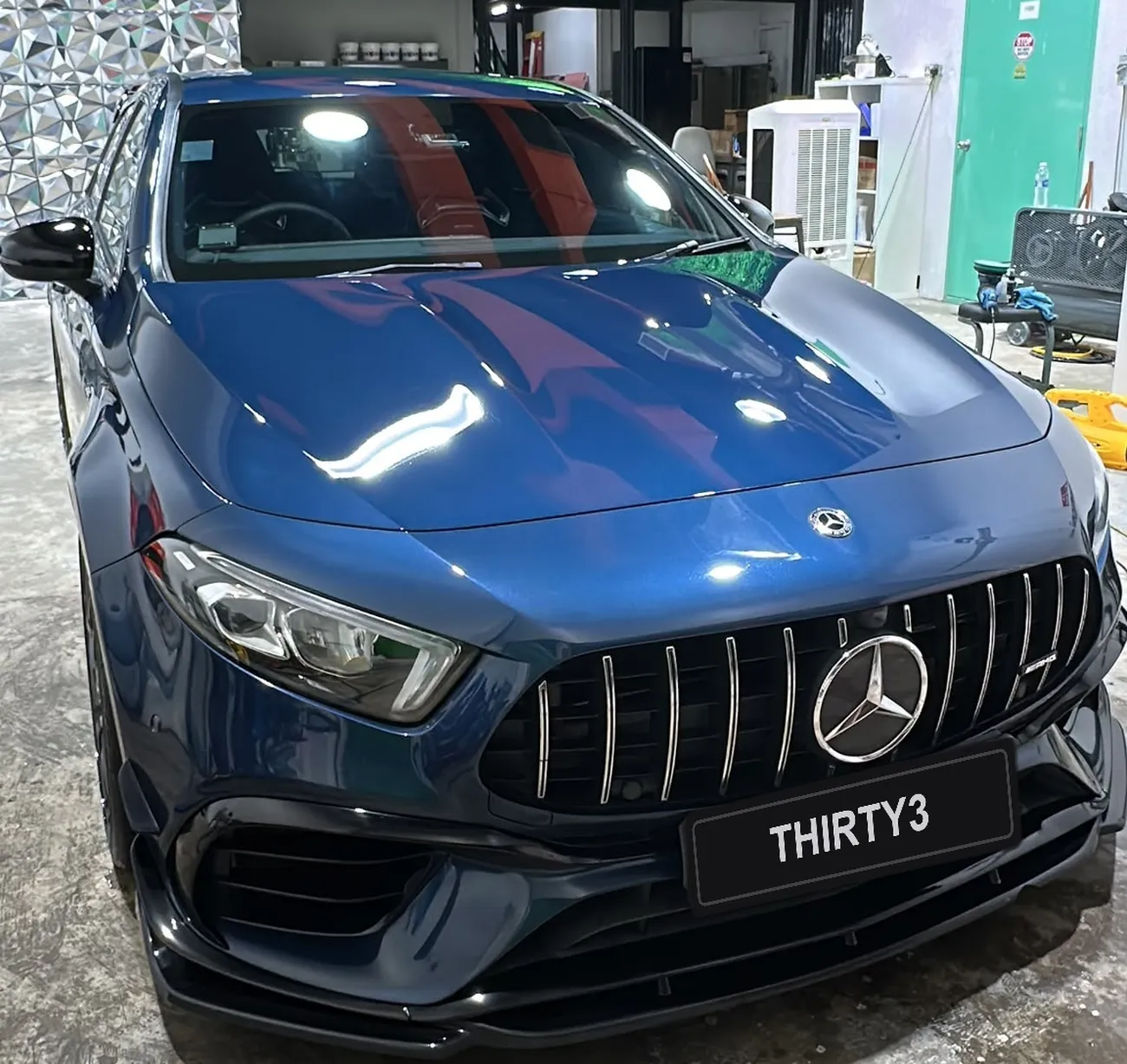 Mercedes-AMG with a machine-polished, mirror-finish bonnet at the detailing studio