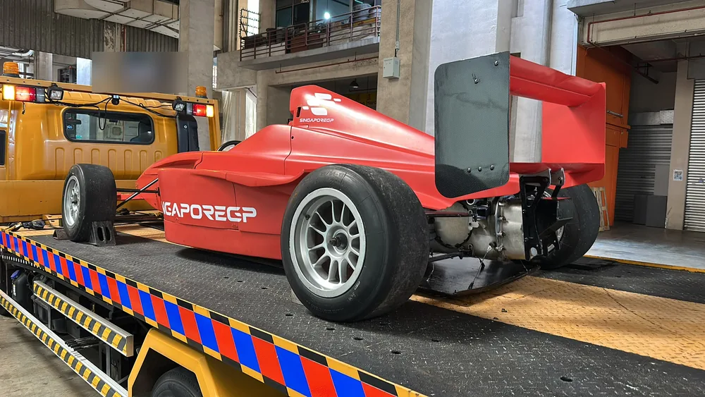 The Singapore GP race car arriving at the studio on a flatbed