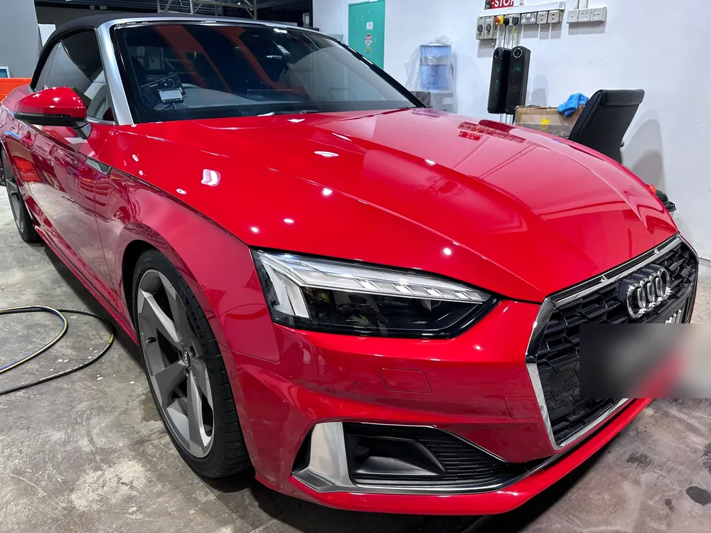 Red Audi convertible, machine polished to a gloss finish