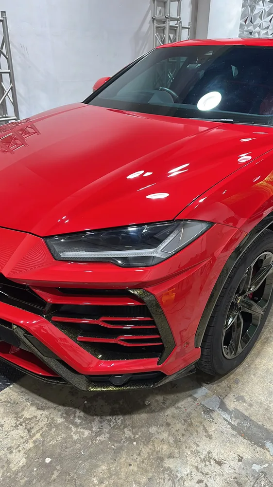 Red Lamborghini Urus after paint correction at the Thirty3 studio
